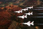Thunderbirds flying in a six-ship delta formation
