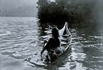 Into the shadow - Clayoquot Indian in boat
