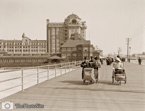wheeled chairs on boardwalk Atlantic City New Jersey - Click Image to Close