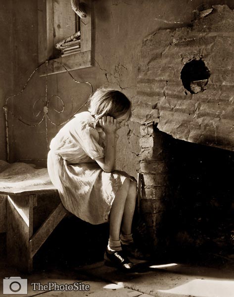 1930's America, resettled farm child girl staring into fireplace - Click Image to Close