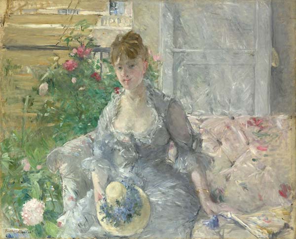 Young woman seated on a sofa - Click Image to Close