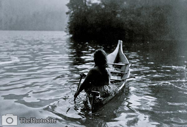 Into the shadow - Clayoquot Indian in boat - Click Image to Close