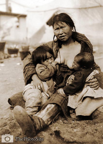 Inuit Eskimo woman breast-feeding two babies - Click Image to Close