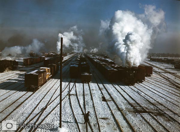 Steam billowing from trains, railroad yard in winter, 1942 - Click Image to Close