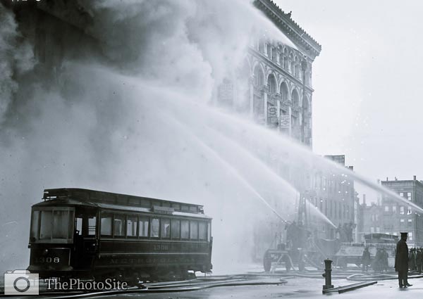 Firemen spraying burning building 14th St. NYC - Click Image to Close