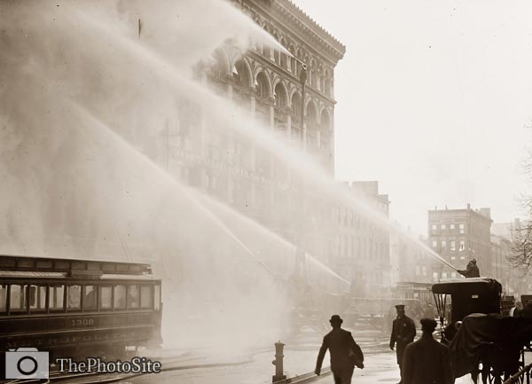 Firemen hosing burning building in New York City - Click Image to Close