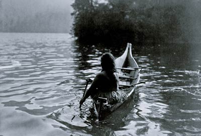 Into the shadow - Clayoquot Indian in boat