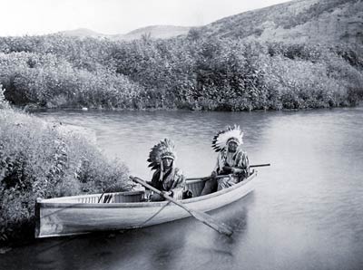 Sioux, Lakota men in canoe, 1902