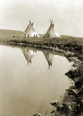 Two tepees reflected in water, 1910