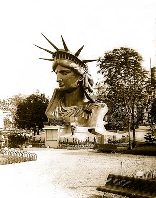 Head of Statue of Liberty on display in park in Paris