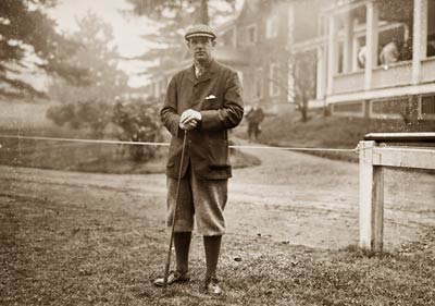 Findlay S. Douglass, with golf club, Baltusrol