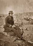 Commander Maxse seated on a rock, Crimean War