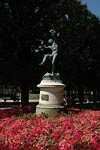 Paris Park, red flowers and statue