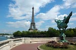Eiffel tower and man on horse sculpture, Paris
