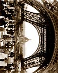 Crowd of people walking under the base of Eiffel Tower 1889