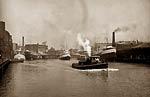 Chicago River scene with steamboat and industrial waterfront